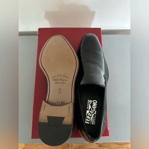 Salvatore Ferragamo Nero Patent Calf Shoes.